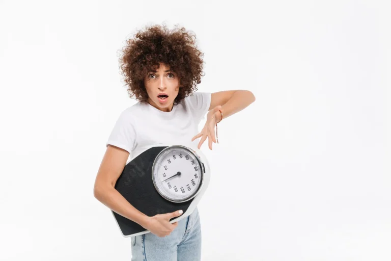 frustrated young casual woman pointing weights