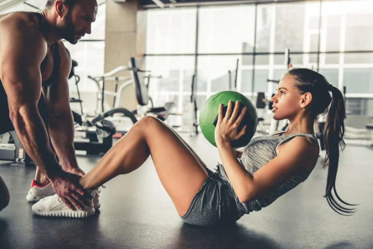 sports people are working out with fitness balls gym